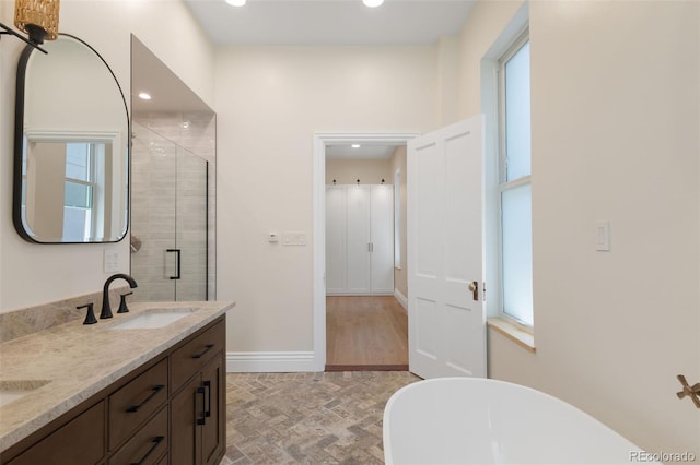 459 N Clarkson St, Denver, CO 80218 - full bath with a freestanding bath, double vanity, recessed lighting, and tiled shower