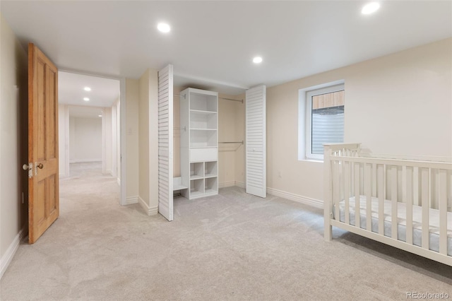 459 N Clarkson St, Denver, CO 80218 - unfurnished bedroom with recessed lighting, light carpet, and a closet