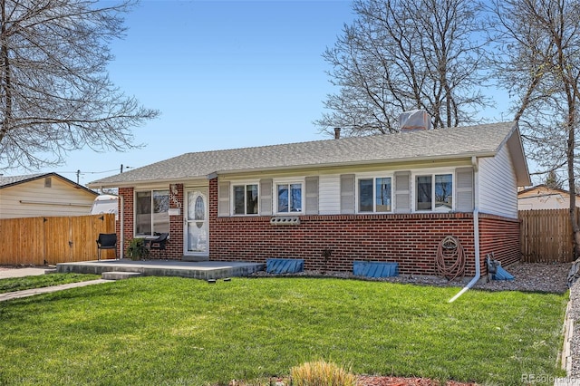 3180 Mowry Pl, Westminster, CO 80031 - view of front of property featuring fence, brick siding, and a front yard