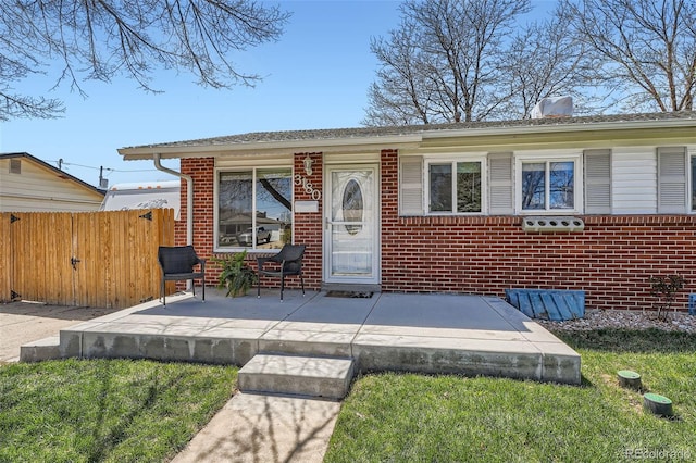 3180 Mowry Pl, Westminster, CO 80031 - view of front of house featuring brick siding and fence