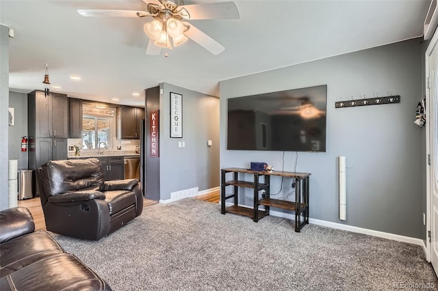 3180 Mowry Pl, Westminster, CO 80031 - living room featuring visible vents, baseboards, recessed lighting, light colored carpet, and a ceiling fan