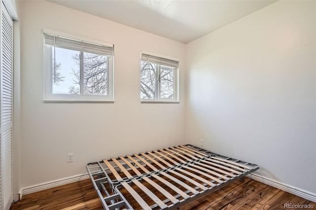 3180 Mowry Pl, Westminster, CO 80031 - unfurnished bedroom with wood finished floors, a closet, and baseboards