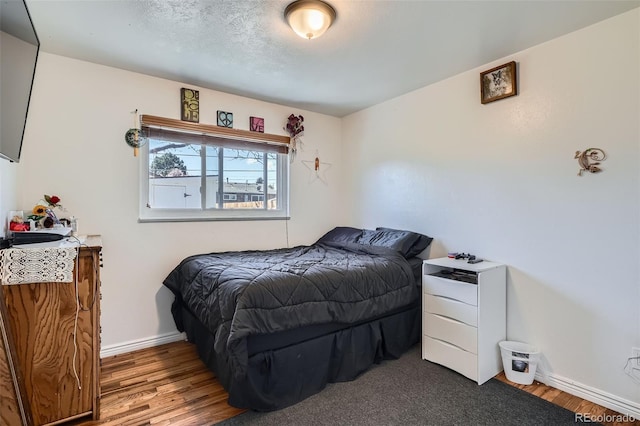 3180 Mowry Pl, Westminster, CO 80031 - bedroom featuring baseboards and wood finished floors