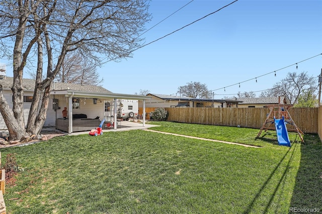 3180 Mowry Pl, Westminster, CO 80031 - view of yard with a patio area, a fenced backyard, and a playground