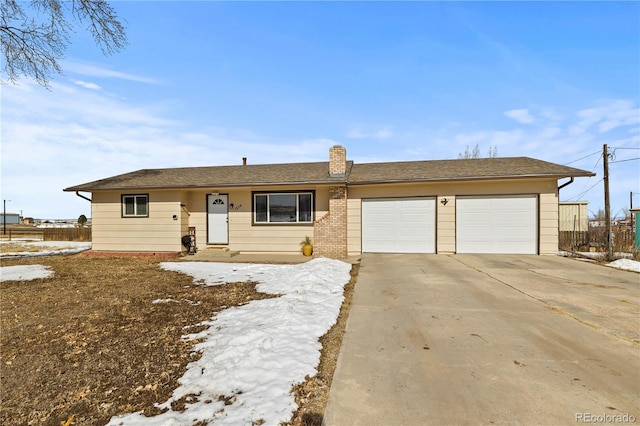 ranch-style house featuring a garage