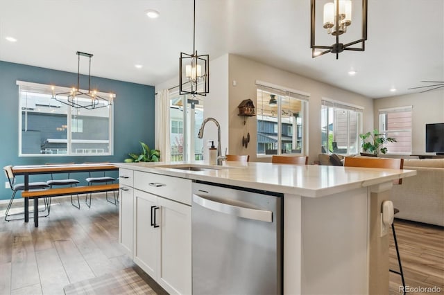 9807 Rosalee Peak St, Littleton, CO 80125 - kitchen featuring a chandelier, dishwasher, a sink, open floor plan, and recessed lighting