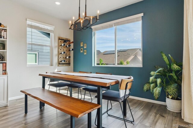 9807 Rosalee Peak St, Littleton, CO 80125 - dining room featuring a chandelier, plenty of natural light, wood finished floors, baseboards, and recessed lighting