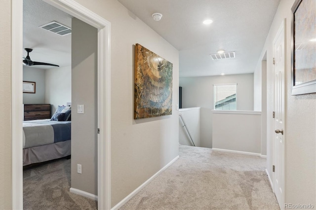 9807 Rosalee Peak St, Littleton, CO 80125 - corridor with an upstairs landing, carpet flooring, and baseboards