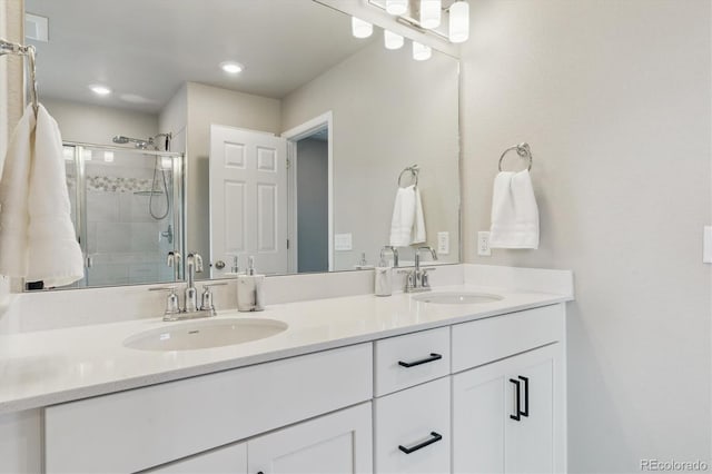 9807 Rosalee Peak St, Littleton, CO 80125 - full bathroom featuring double vanity, a shower stall, and recessed lighting