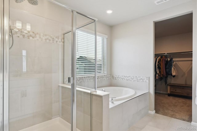 9807 Rosalee Peak St, Littleton, CO 80125 - full bathroom featuring a stall shower, a garden tub, tile patterned flooring, and recessed lighting