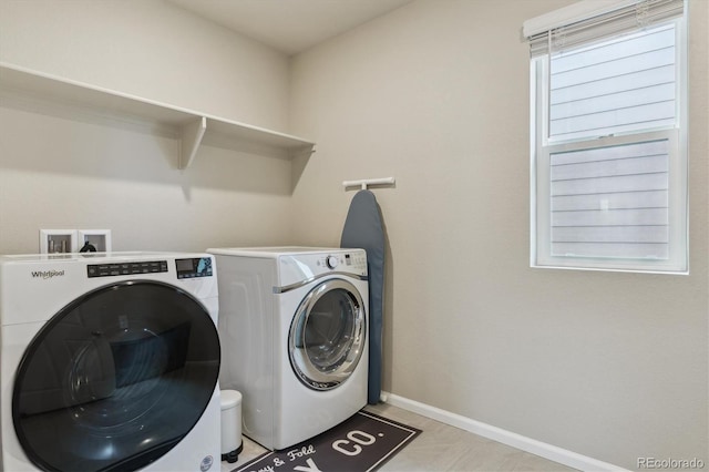 9807 Rosalee Peak St, Littleton, CO 80125 - washroom with washer and clothes dryer and baseboards