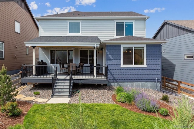 9807 Rosalee Peak St, Littleton, CO 80125 - view of front facade featuring a wooden deck and roof with shingles