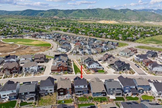 9807 Rosalee Peak St, Littleton, CO 80125 - aerial view of property and surrounding area with mountains and nearby suburban area