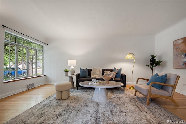 1439 Dexter St, Denver, CO 80220 - living area featuring wood finished floors and baseboards