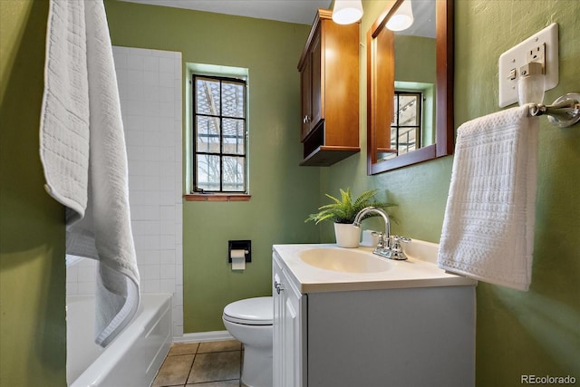 1439 Dexter St, Denver, CO 80220 - bathroom with tile patterned floors, toilet, vanity, baseboards, and bathtub / shower combination