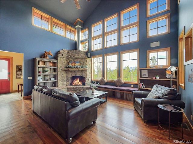 77 B Rd, Silverthorne, CO 80498 - living room with high vaulted ceiling, hardwood / wood-style floors, a fireplace, ceiling fan, and baseboards
