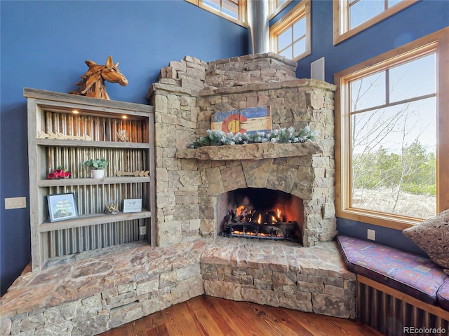 77 B Rd, Silverthorne, CO 80498 - living room featuring wood finished floors and a stone fireplace