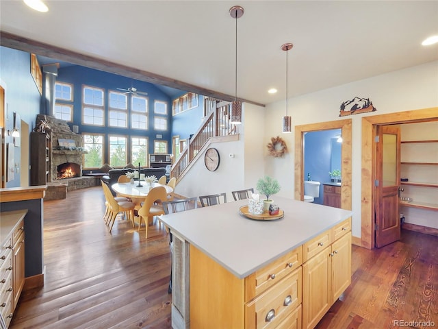 77 B Rd, Silverthorne, CO 80498 - kitchen featuring a stone fireplace, a ceiling fan, dark wood-type flooring, light brown cabinets, and recessed lighting