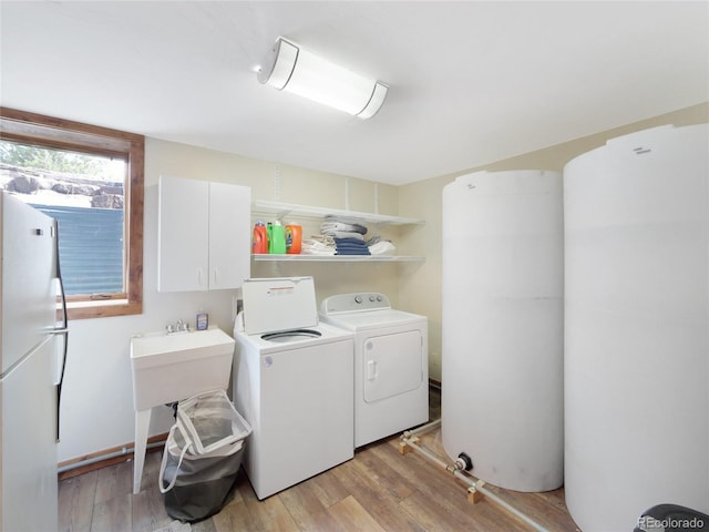 77 B Rd, Silverthorne, CO 80498 - washroom with washing machine and clothes dryer and light wood-type flooring