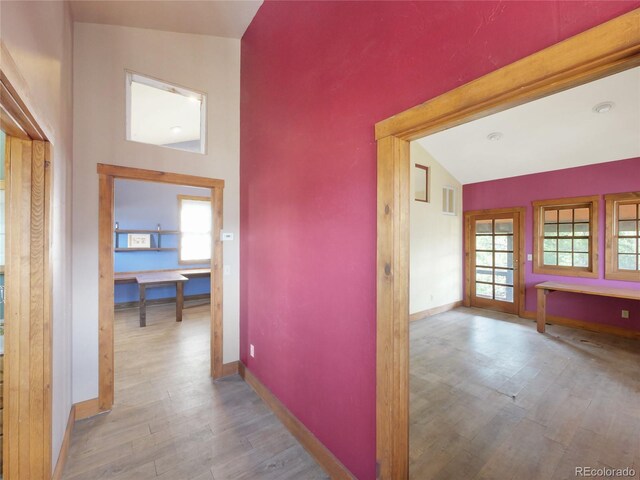 77 B Rd, Silverthorne, CO 80498 - hallway featuring wood finished floors, vaulted ceiling, and baseboards