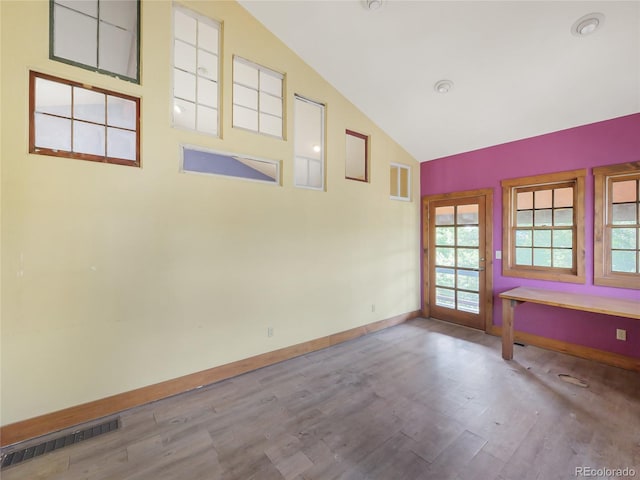 77 B Rd, Silverthorne, CO 80498 - empty room featuring wood finished floors, baseboards, and high vaulted ceiling