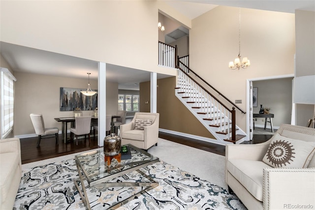 8182 Sweet Water Rd, Lone Tree, CO 80124 - living room with a towering ceiling, wood finished floors, stairway, baseboards, and a notable chandelier