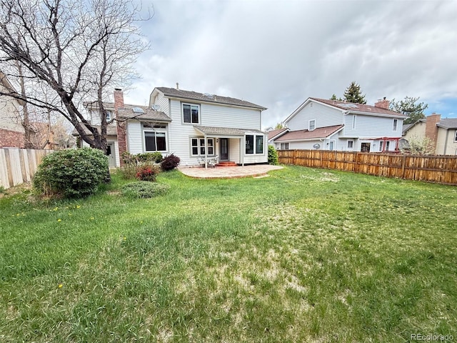 8182 Sweet Water Rd, Lone Tree, CO 80124 - rear view of property with a lawn, a patio area, and fence