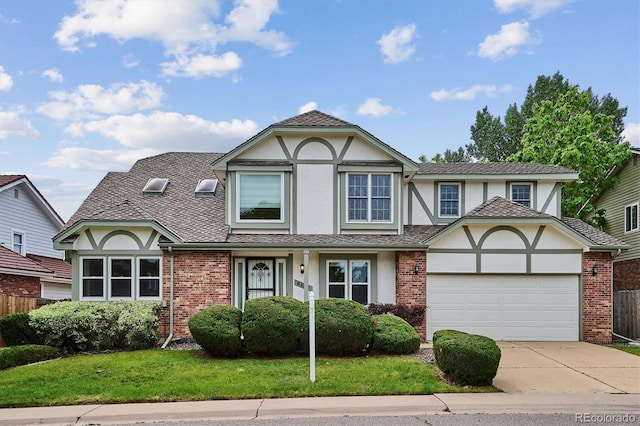 8182 Sweet Water Rd, Lone Tree, CO 80124 - tudor home with stucco siding, driveway, an attached garage, and brick siding