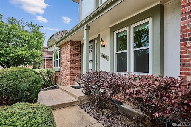 8182 Sweet Water Rd, Lone Tree, CO 80124 - doorway to property with brick siding