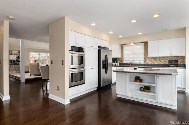 8182 Sweet Water Rd, Lone Tree, CO 80124 - kitchen with stainless steel appliances, open shelves, a sink, white cabinetry, and recessed lighting