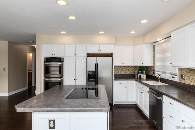 8182 Sweet Water Rd, Lone Tree, CO 80124 - kitchen with stainless steel appliances, a sink, dark wood-style floors, dark countertops, and recessed lighting