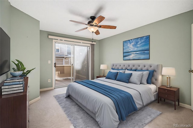 bedroom with ceiling fan and light colored carpet