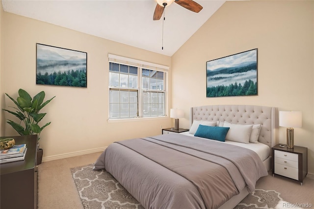 bedroom featuring vaulted ceiling, ceiling fan, and light colored carpet