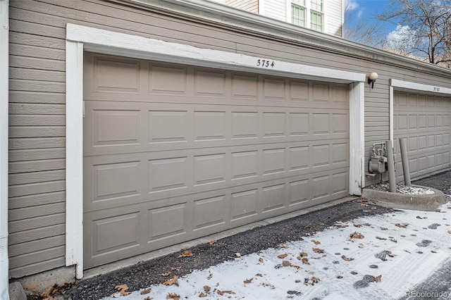 view of snow covered garage