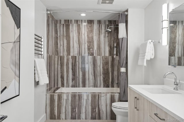 bathroom featuring toilet, visible vents, shower / bath combo with shower curtain, and vanity