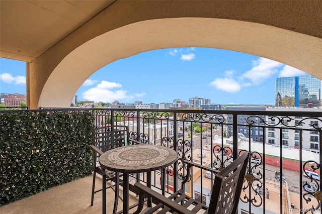 balcony featuring a city view