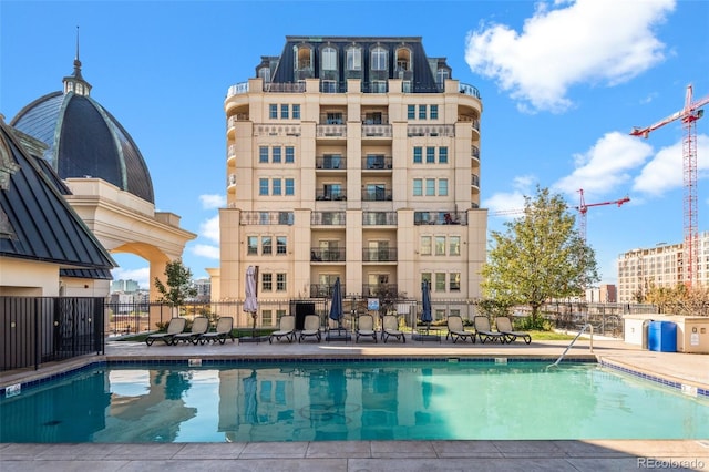 view of pool featuring a patio area and fence