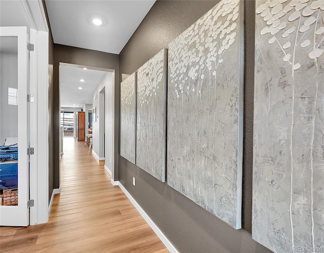 hallway with wood-type flooring