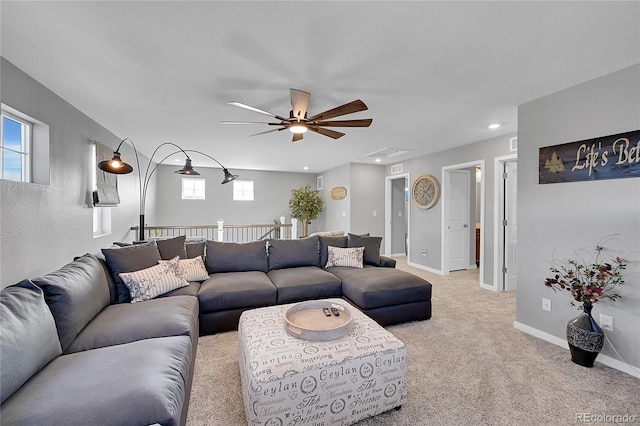 carpeted living room featuring ceiling fan