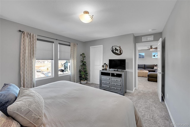 bedroom with light colored carpet