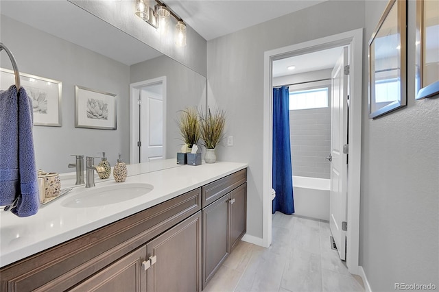 full bathroom with vanity, toilet, and shower / bath combo