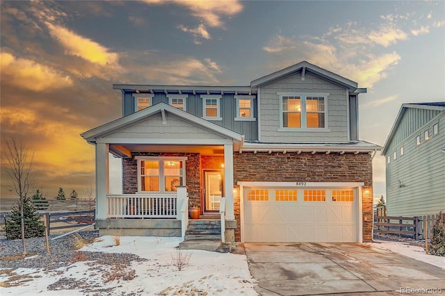 craftsman-style house with a garage and covered porch