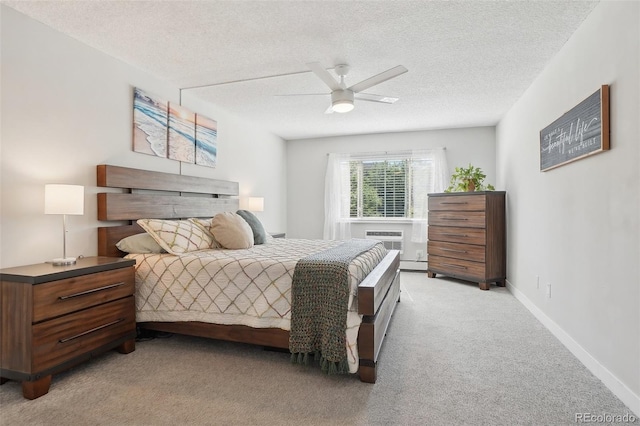 3465 S Poplar St Unit 305, Denver, CO 80224 - bedroom with light carpet, a textured ceiling, a ceiling fan, and baseboards