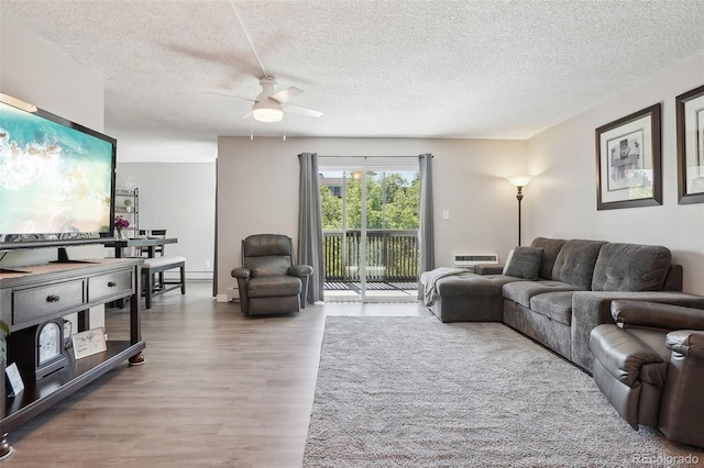 3465 S Poplar St Unit 305, Denver, CO 80224 - living room with a textured ceiling, wood finished floors, and a ceiling fan