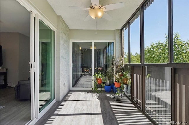 3465 S Poplar St Unit 305, Denver, CO 80224 - unfurnished sunroom with ceiling fan, healthy amount of natural light, and a baseboard radiator