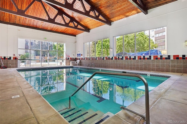 3465 S Poplar St Unit 305, Denver, CO 80224 - indoor pool featuring a patio and fence