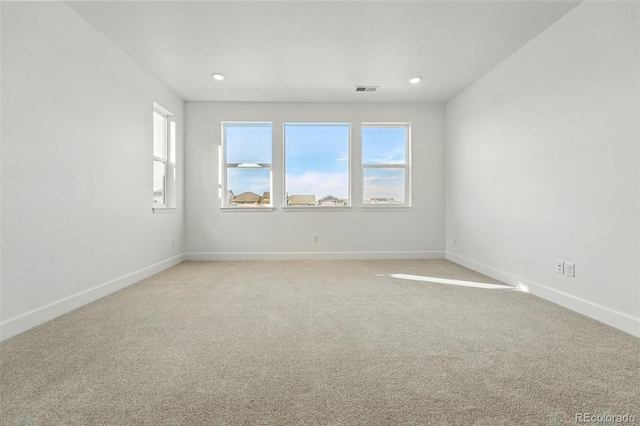 16537 Black Rose Cir, Parker, CO 80134 - unfurnished room featuring visible vents, baseboards, light colored carpet, and a wealth of natural light