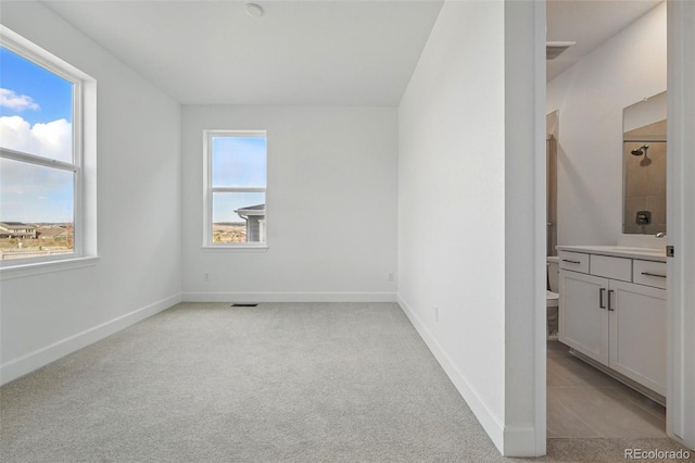 16537 Black Rose Cir, Parker, CO 80134 - unfurnished room featuring baseboards, visible vents, and light colored carpet