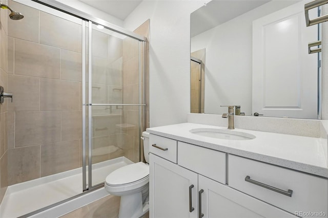 16537 Black Rose Cir, Parker, CO 80134 - bathroom featuring toilet, vanity, and a shower stall