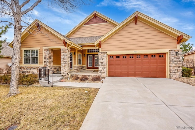 craftsman-style house featuring stone siding, concrete driveway, a shingled roof, and an attached garage